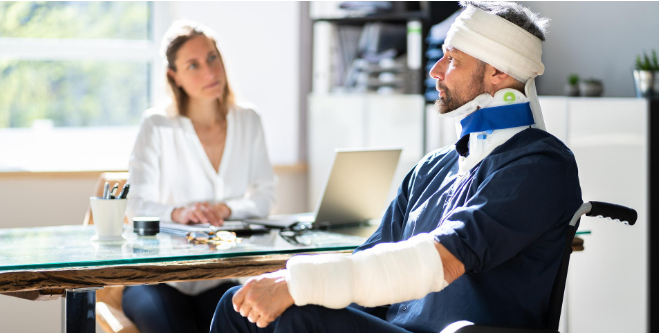 A man speaking with a financial adviser at a desk